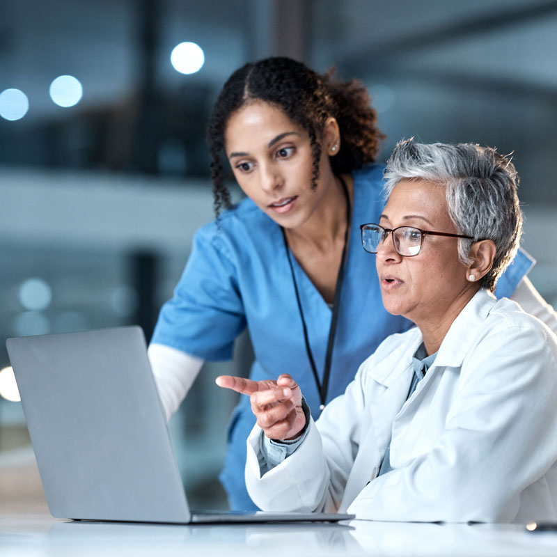 Doctors Looking at a Computer